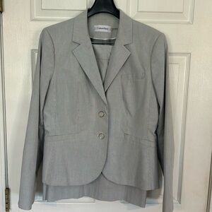 Light blue and white beautiful Calvin Klein suit size 12 jacket, size 10 skirt.
